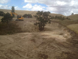 Digger in distance on newly constructed farm track
