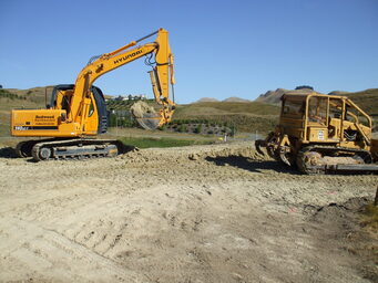 Diggers working on levelling a site ready for building works to commence